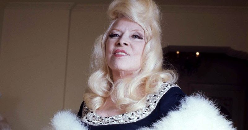 Pictures of Mae West in Her Living Room at Ravenswood, Los Angeles in 1973