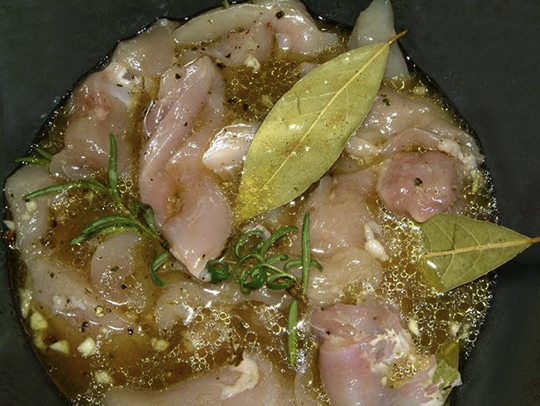 Preparing chicken to make Pollo alla Cacciatora