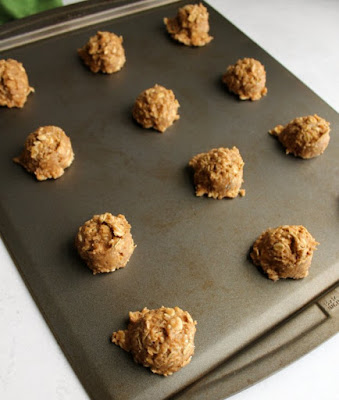 These easy to make cookies are loaded with whole grains but they are still soft and delicious. They are good on their own, but even better topped with maple cream cheese frosting! scoops of banana bread cookie dough