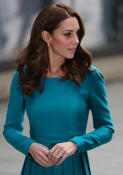 Kate Middleton is repeating her teal Emilia Wickstead dress and her Asprey leaf earrings. Kate is wearing a teal Emilia Wickstead dress