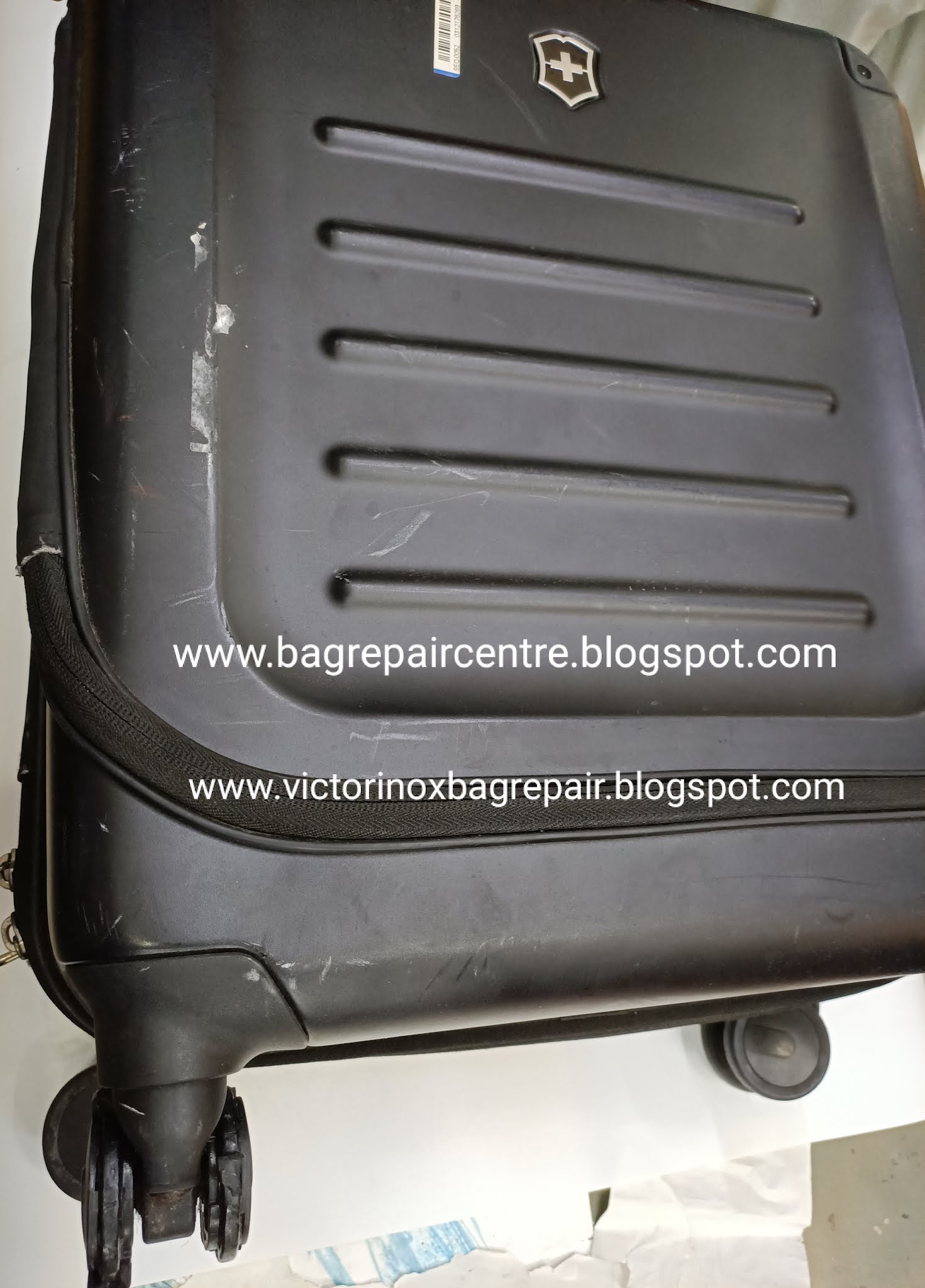 Victorinox bag repair, luggage wheel replacement, zipper, stitching