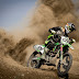 Rider Riding Green Motocross Dirt Bike