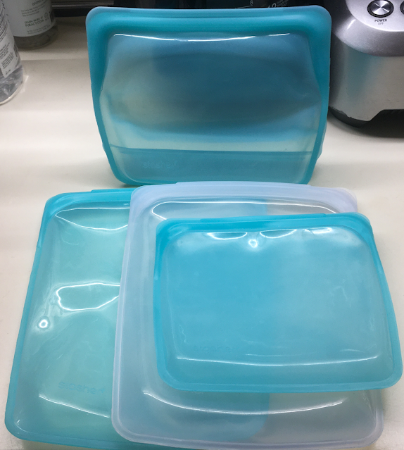Four Stasher silicone food storage bags