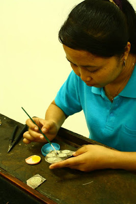 Assembling the earring at gold and silversmith workshop in Celuk Village