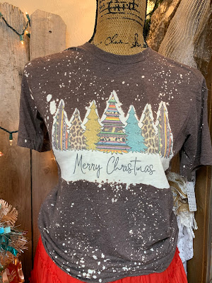 serape and leopard print Christmas trees on a "snowy" bleached tee shirt