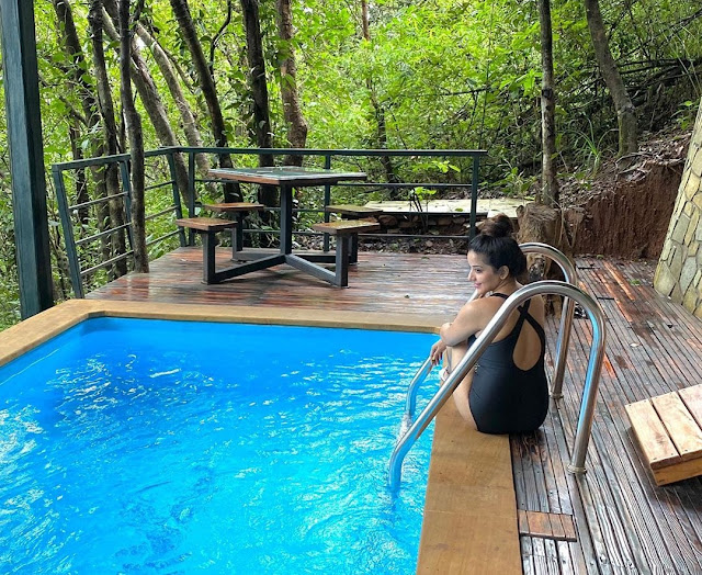 Monalisa looks enchanting in black monokini as she takes a dip in pool- newsdezire