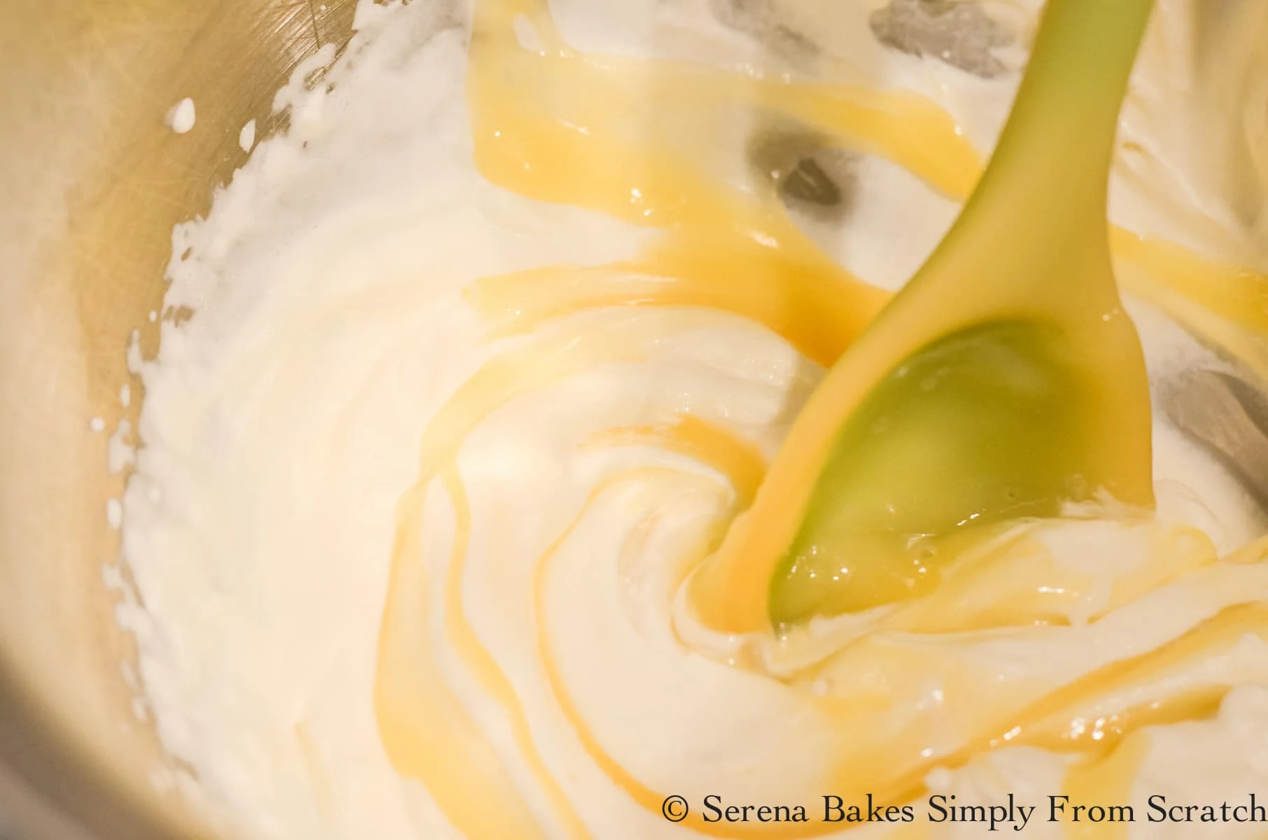 Beaten Whipped Cream with Pineapple Pudding being folded in.