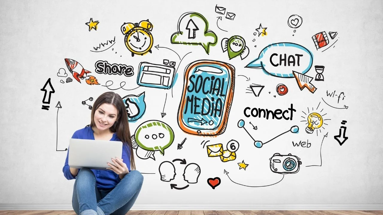 Portrait of a smiling teen girl with long dark hair wearing blue jeans and a shirt and holding her laptop doing social media research.