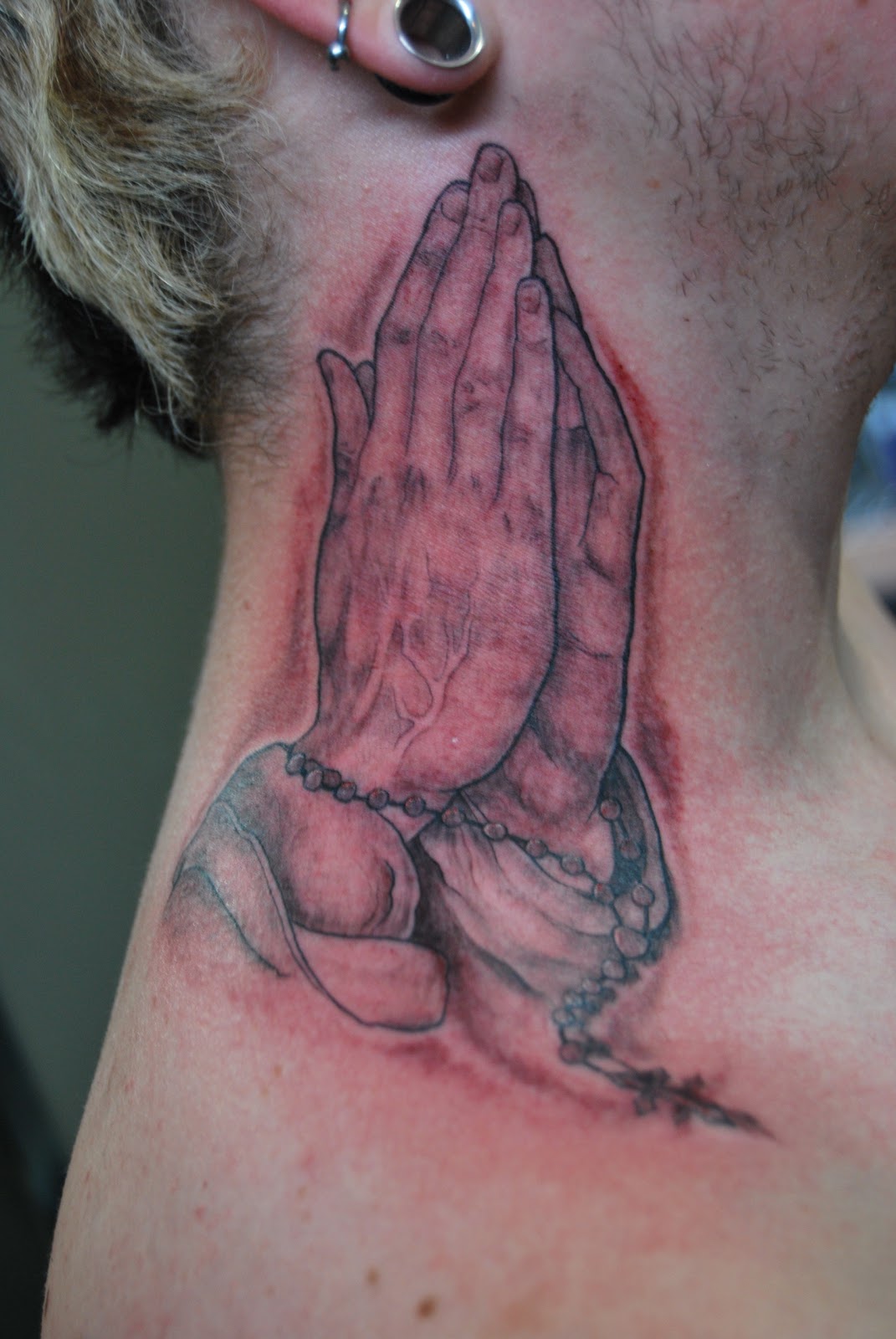 Custom Tattooing by Dan Bertram: praying hands on neck