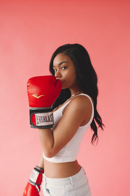 https://www.pexels.com/photo/photo-of-woman-wearing-red-boxing-gloves-3225889/