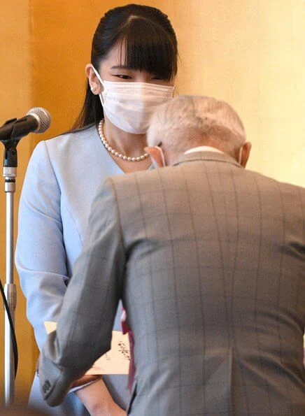 Princess Mako of Japan wore a pearl necklace and a blue v-neck midi dress