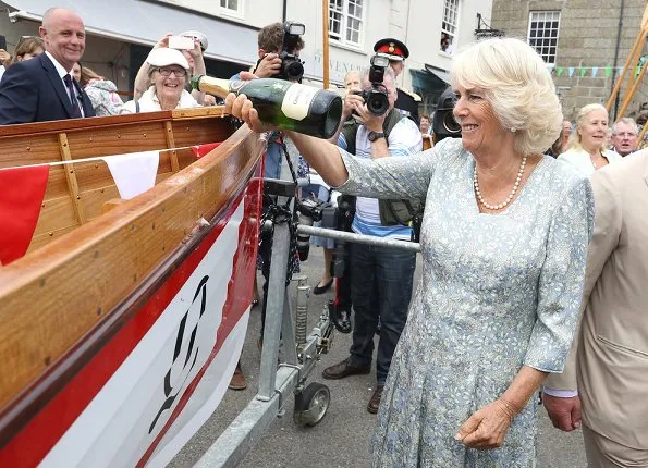 The Duchess of Cornwall wears a pale blue floral midi dress for the visit. Prince Charles, Prince Willaim, Prince Harry, Meghan Markle, kate Middleton