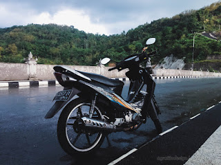 Motorcycle Parking On The Highway Roadside On The Hills In The Cloudy And Rainy At The Village