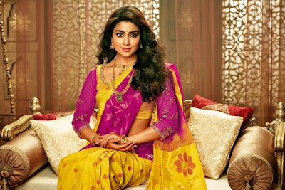 Shriya Saran in purple and yellow color saree