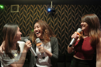 three girls laugh happily and holdng mic in hand singing in the iPOP karaoke box setapak kuala lumpur named stepheny, puiyeesss and winx