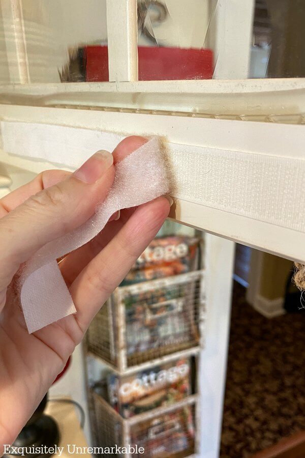 Removing Velcro strip from a cabinet door