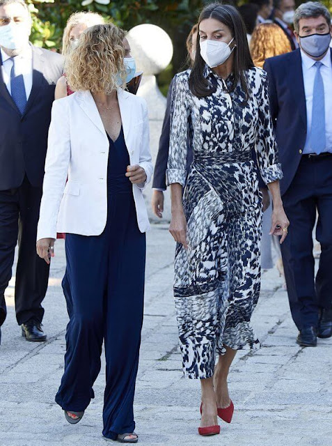 Queen Letizia wore a leopard print silk blouse and midi skirt from Victoria Beckham, and red leathe pumps from Carolina Herrera