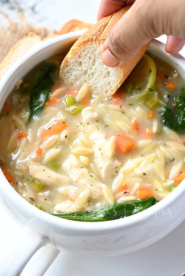 bread dipped in thick creamy chicken orzo soup