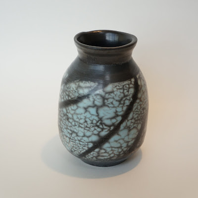 Beautiful colored naked raku pottery vase by Lily.