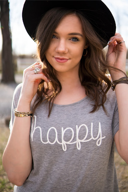 Girl wearing a black hat