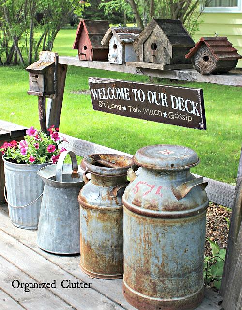 Decorating the Yard & Garden with Vintage Milk Cans #vintage #farmtools #milkcan #creamcan #junkgarden #outdoordecorating