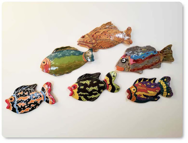 Group similar fish designs together Fish wall decor