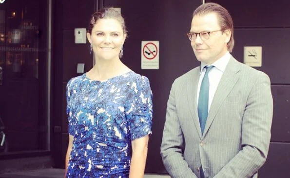 Crown Princess Victoria wore a floral dress by Rodebjer, and navy sandals by Saint Laurent, and blue diamond duchess earrings by Ebba Brahe