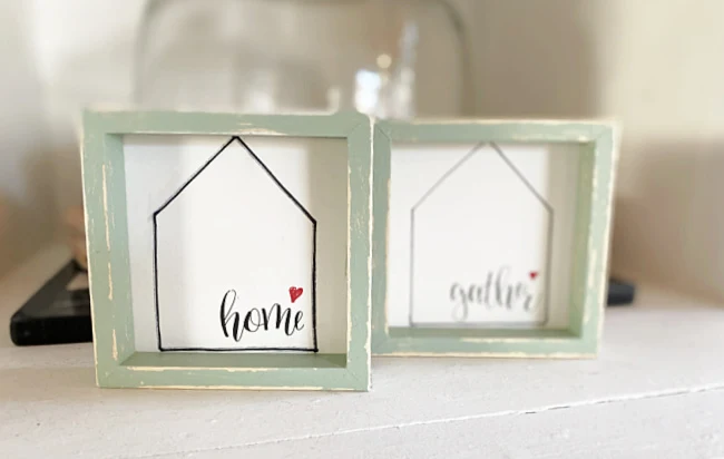 home and gather signs with green frames