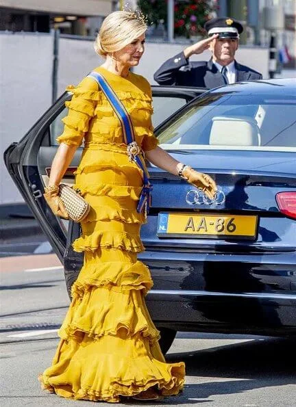 Queen Maxima wore a yellow dress from Claes Iversen Haute Couture SS17 collection. Bottega Veneta intrec knot clutch