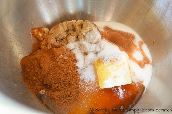 Pumpkin Cinnamon Roll filling butter, brown sugar, vanilla, honey, and cinnamon in a bowl.