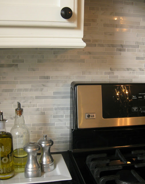 marble backsplash installation behind stove