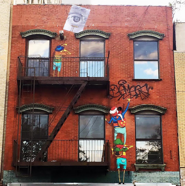 The Brazilian twins Os Gemeos just teamed up with JR for yet another new collaboration which just took place on the busy streets of New York City.