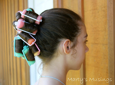 A woman standing in front of a mirror