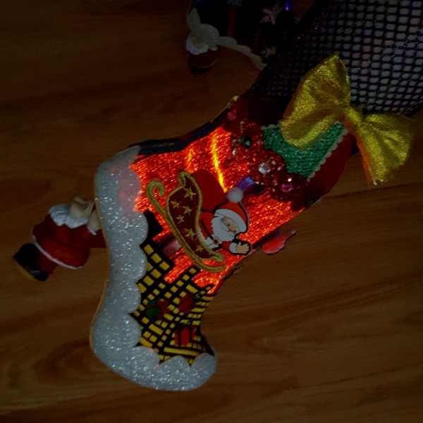 red light up ankle boot with floating Santa sleigh