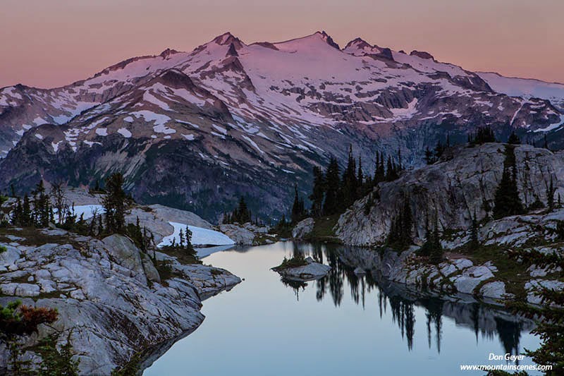Morning alpenglow on Mount Daniel above Lower Robin Lake in the Alpine Lakes Wilderness, Cascade Range, Washington, USA.