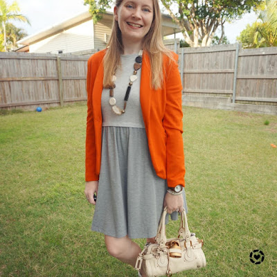 awayfromblue Instagram | orange blazer with grey skater dress chloe mini paddington bag business casual office outfit
