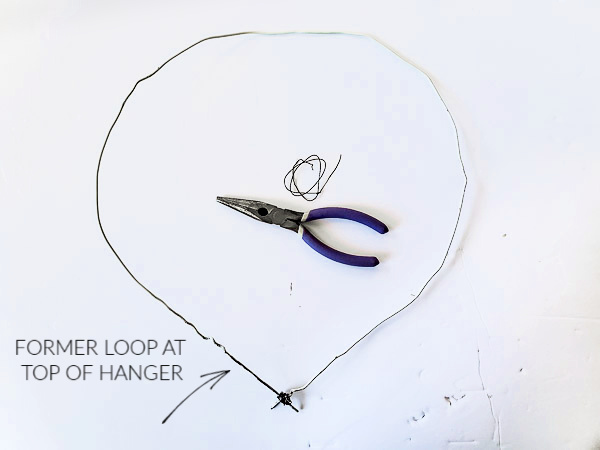 turning a coat hanger into a heart shape