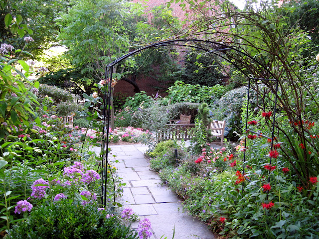 The Arch welcomes visitors to this special Old New York garden, The Gardens At Saint Luke in the Fields