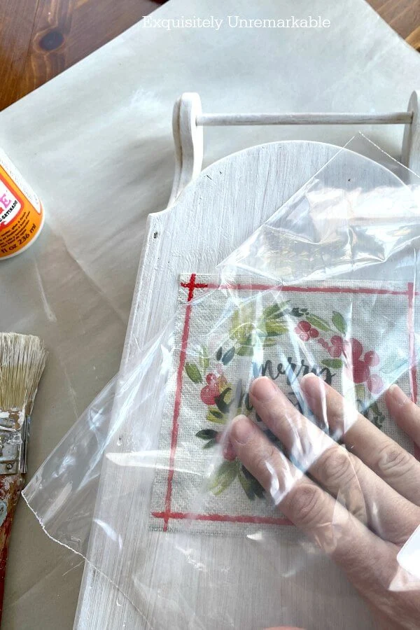 Using Plastic Wrap To Decoupage Napkins