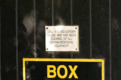 Photograph showing close-up detail of the AA box: a sign, 'CALL BOX NO LONGER IN USE AND HAS BEEN CLEARED OF ALL COMMUNICATIONS EQUIPMENT'