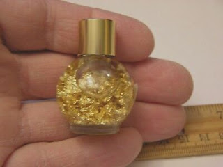 Gold flecks in a bottle