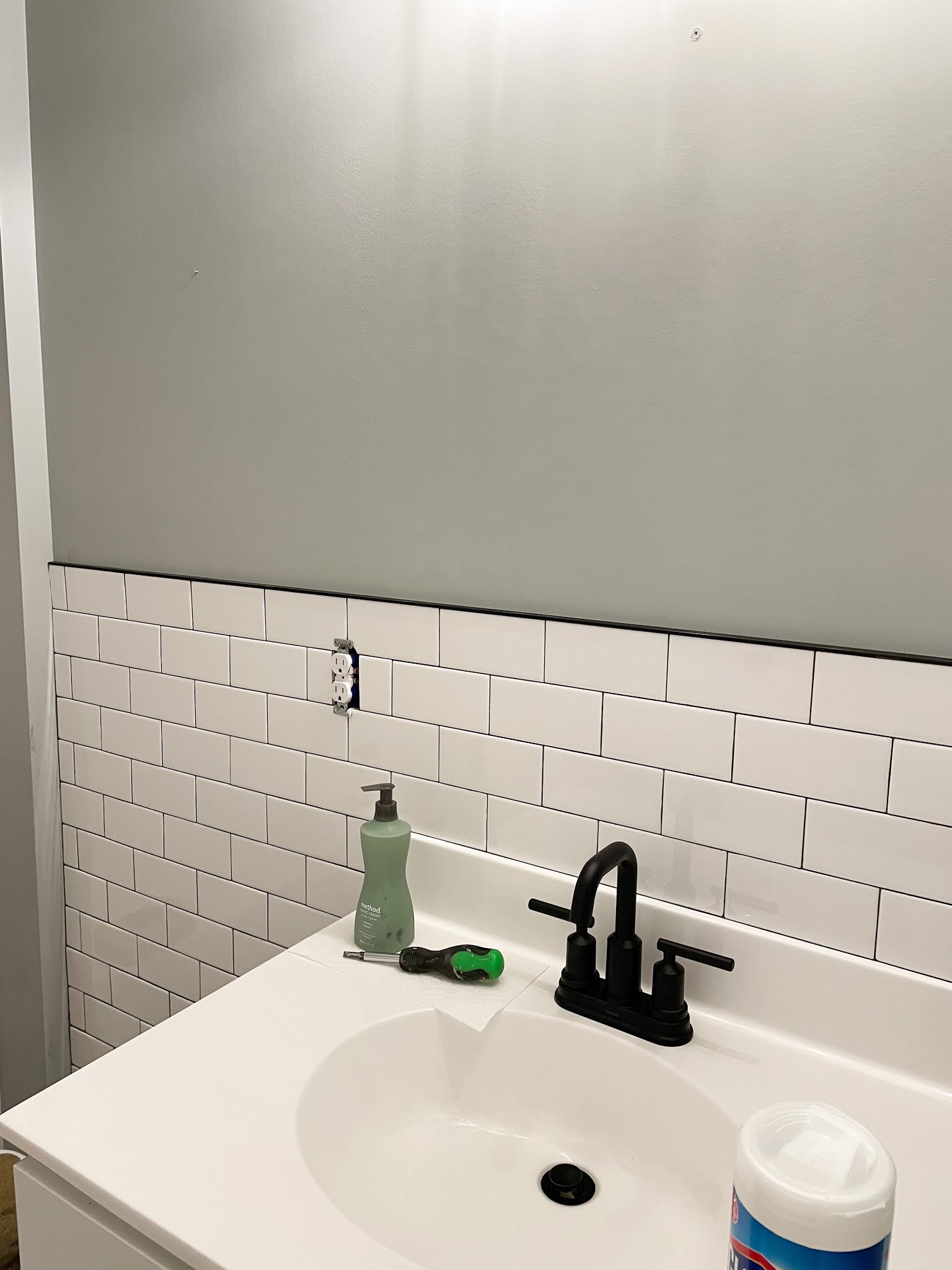 DIY MODERN FARMHOUSE BATHROOM WITH TILE WALL & DARK GROUT | A Classy Fashionista