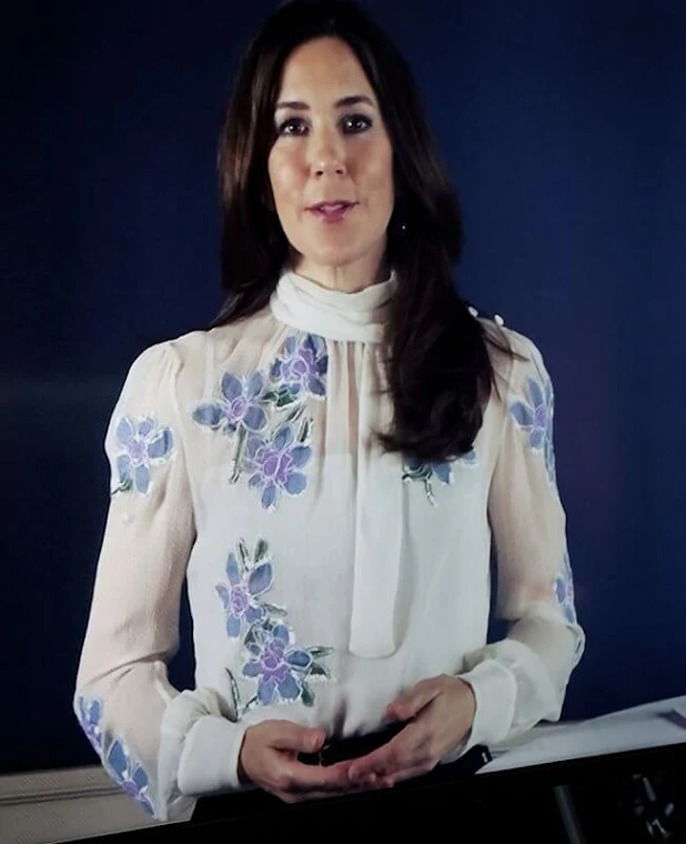 Crown Princess Mary wore a light blue floral embroidered chiffon pussy-bow blouse from Prada