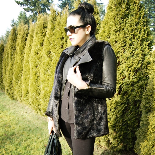Black Simply Vera Wang faux fur vest, Mackage Kenya leather and a Celine Mini Luggage handbag.