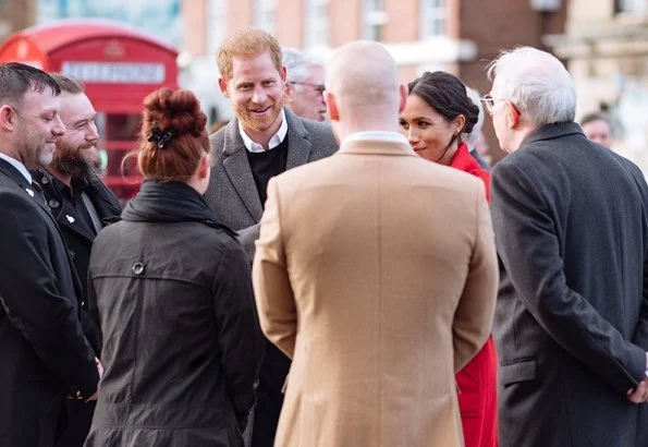 Meghan Markle wore ARITZIA Babaton Maxwell dress, and Sentaler coat, Stuart Weitzman suede pumps, Gabriela Hearst Demi bag