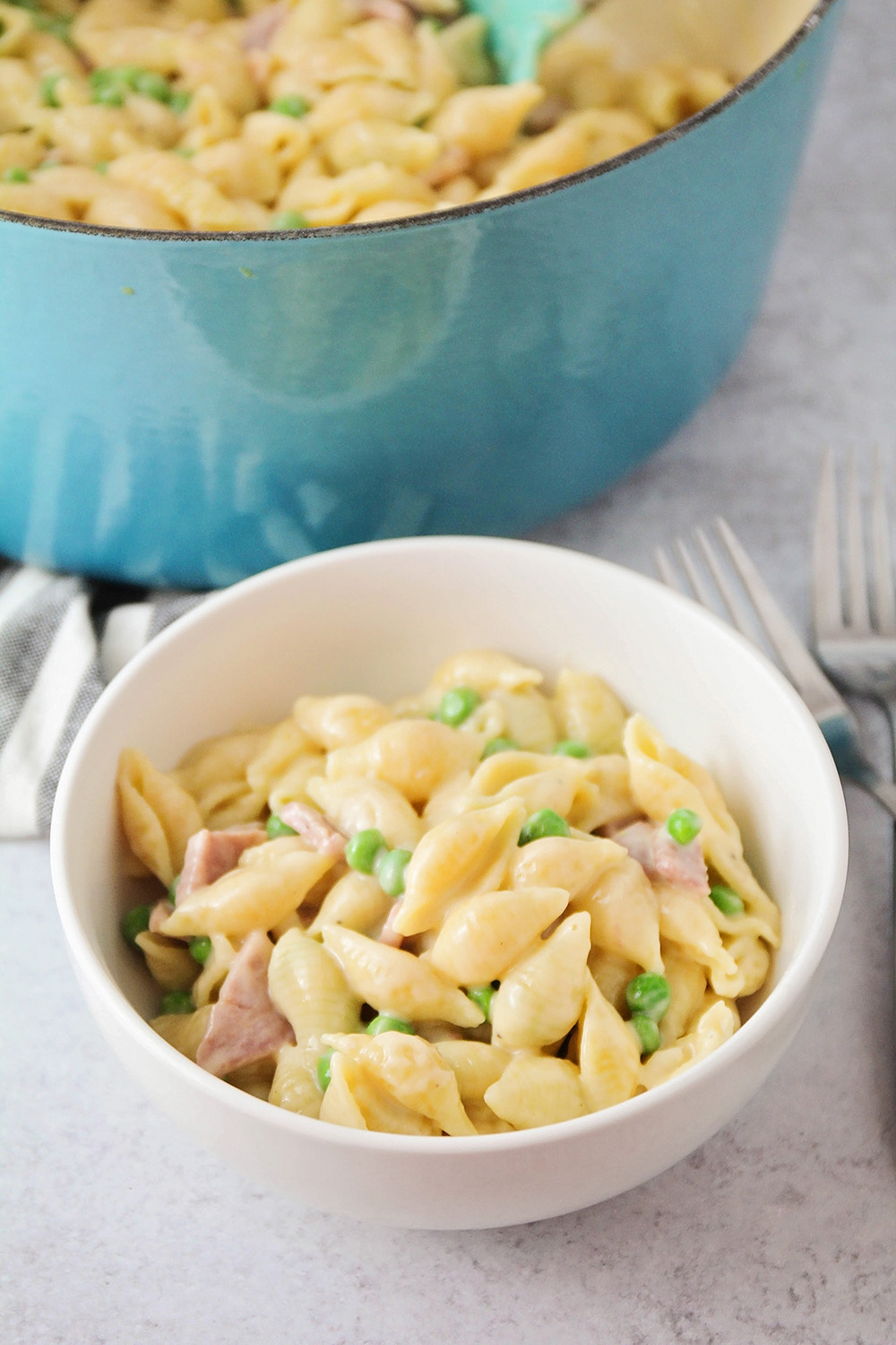This cheesy ham and pea pasta is ready in about thirty minutes, and totally delicious!