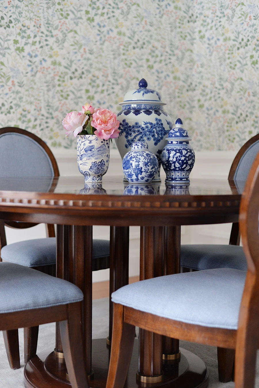 traditional dining room, oval back chairs, blue and white ginger jar collection, Scandinavian floral wallpaper