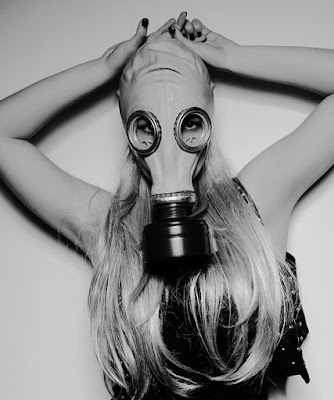 blonde woman in gas mask