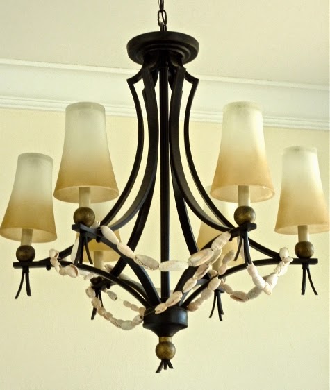 shell garland draped over chandelier