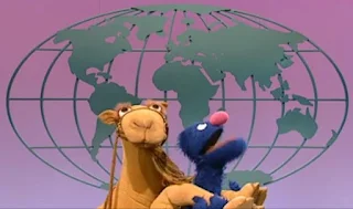 Sydney rides on Global Grover. Sesame Street Episode 4071